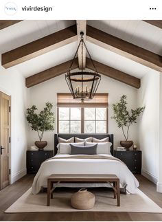 a large bed sitting under a window in a bedroom