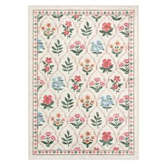 a white rug with flowers and leaves on the side, in front of a white background