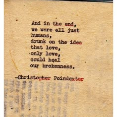 an old typewriter with the words, and in the end we were all just humans drink on the idea that love could heal our brokenness