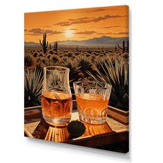 two glasses of whiskey on a tray in front of a desert landscape with cactus trees