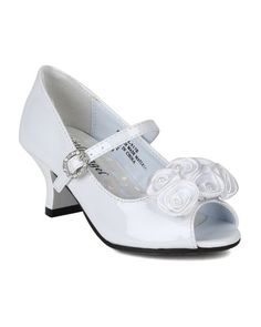 a pair of white shoes with flowers on the heel