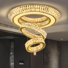 a chandelier hanging from the ceiling in a room