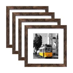 three wooden frames with a yellow tram in the middle one has a black and white photo on it