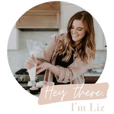 a woman standing in front of a kitchen counter with food on it and the words hey there, i'm liz