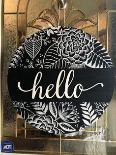 a black and white sign that says hello