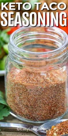 a jar filled with keto taco seasoning next to a spoon