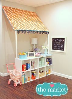 a play house made out of an old bookcase