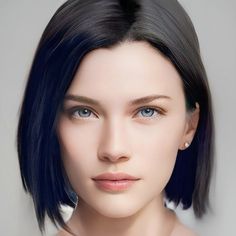 a woman with short black hair and blue eyes