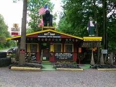 a small building with an american flag on top