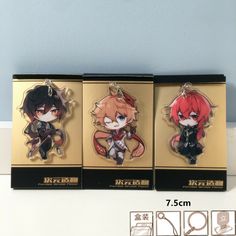 three keychains with anime characters on them