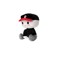 a black and white stuffed animal with a red hat sitting on top of it's head