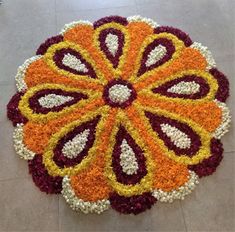 a large flower arrangement is on the floor