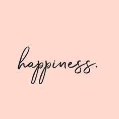 the word happiness written in black ink on a pink background