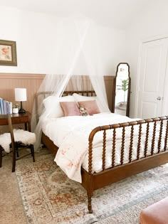 a bedroom with a bed, dresser and mirror in it's centerpieces