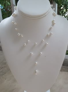 "Bridal Illusion Necklace ~ This lovely 2 strand invisible necklace is made with a white Swarovski tear pearl paired with smaller 5mm and 6mm round Swarovski pearls. Created on illusion wire, the crystals and pearls seem to float on your neck! Makes wonderful bridal jewelry or bridesmaids gift. The necklace measures approximately 15\" along the shorter strand and 17\" on the longer. An extender chain adds 2\" of length. 15\" is shorter than typical necklaces, which are 16.5\", so please contact Pearl Back Chain, Illusion Pearl Necklace, Pearl Necklace Designs Unique, Invisible Necklace, Bridal Jewelry Pearl, Diy Earrings Materials, Diy Pearl Necklace, Jewelry Pearl Necklace, Illusion Necklace