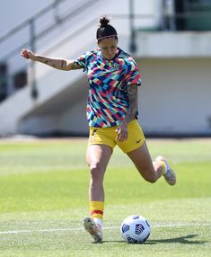 a female soccer player in action on the field