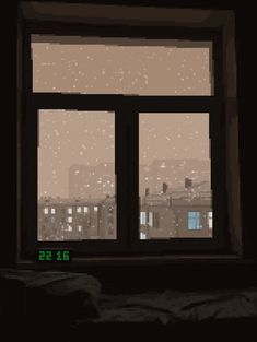 an image of a window in the dark with snow falling on it and buildings outside