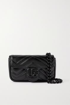 This 2.0 version of Gucci's 'GG Marmont' bag can be worn a variety of ways - simply carry it cross-body or adjust the hook-fastening strap to style it around your waist. It's been made in Italy from supple quilted black leather and opens to a compact interior that'll hold the essentials - think your phone, cardholder and lipstick. Gucci Black Purse, All Black Gucci Bag, Gucci Soft Leather Crossbody Shoulder Bag, Gucci Crossbody Shoulder Bag With Adjustable Strap, Gucci Soft Leather Crossbody Bag, Gucci Soft Leather Shoulder Bag, Black Gucci Bag With Adjustable Strap, Gucci Crossbody Shoulder Bag For Everyday Use, Gucci Soft Leather Top Handle Shoulder Bag