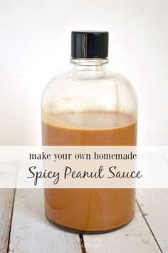 homemade spicy peanut sauce in a glass bottle with the words make your own homemade spicy peanut sauce