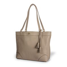 Crafted of pebbled Italian leather in a versatile taupe hue, the Charleston tote really holds its own when it comes to style and organization. Designed for season-to-season everyday use, it has a magnetic top closure that opens to reveal a green lining for easy spotting of your keys or lip balm. Stash essentials in the two interior open pockets or the zipped back pocket. This wide and roomy tote has reinforced corners with feet, making it a sturdy, stylish sidekick. Plus, the shoulder straps hav Classic Taupe Bags With Leather Lining, Taupe Textured Leather Bag For Everyday, Taupe Soft Leather Work Bags, Classic Taupe Bag With Leather Lining, Classic Taupe Bags For Work, Taupe Smooth Grain Bag For Everyday Use, Classic Taupe Bag For Work, Classic Taupe Workwear Bags, Textured Leather Travel Bags In Taupe