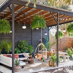 an outdoor living area with plants and furniture