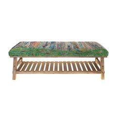 a wooden bench with a green cushion on it