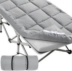 an image of a portable cot with mattress on it