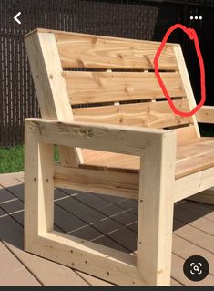 a wooden bench sitting on top of a patio