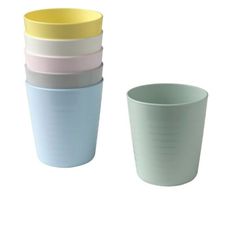 four different colored cups sitting next to each other