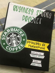 a starbucks coffee book sitting on top of a table