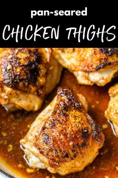 chicken thighs in a pan with sauce on top and the words, pan - seasoned chicken thighs