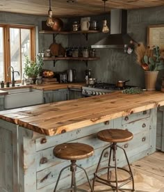 a kitchen with two stools in front of an island and wooden counter tops on the floor