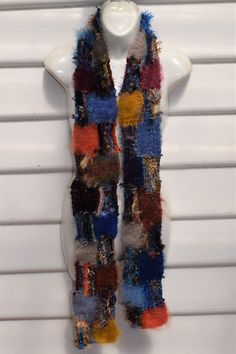 Scarf is handknitted in patchwork style and OOAK Combines many different yarns and textures Is 180cm long and 12cm wide Is multi colored and textured Thick and warm Care is handwash and dry flat, no iron Bohemian Wool Scarves Handmade, Handmade Wool Scarves In Bohemian Style, Bohemian Handmade Wool Scarves, Handmade Yarn Scarves One Size, One Size Multicolor Yarn Scarves, Multicolor Knit Scarves One Size, Multicolor Knitted Winter Scarves, Bohemian Knit Scarves One Size, Artisan Handmade Scarves For Winter