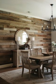 A dining room featuring a rustic wood plank accent wall for a farmhouse vibe. Rustic Dining Room