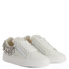 Low-top sneakers, crafted from white leather and embellished with silver metal hardware with crystal rhinestones on the back of the upper, featuring a white lacquered metal 'Signature' detail on the tongue and white plastic side zipper fastenings, a matching rubber sole completes the design of this model. Crystal Sneakers, White Platform Sneakers, Shoes Design, The Tongue, White Accessories, White Sneakers Women, Womens Summer Shoes, Bridal Inspo