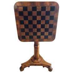 a wooden chess board sitting on top of a stand