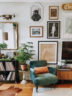 a living room filled with furniture and lots of pictures on the wall above it's tv