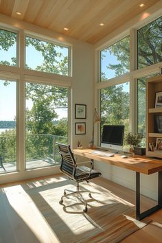 a home office with large windows overlooking the water