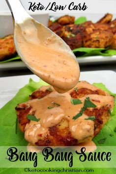 a close up of a plate of food with sauce being drizzled on it