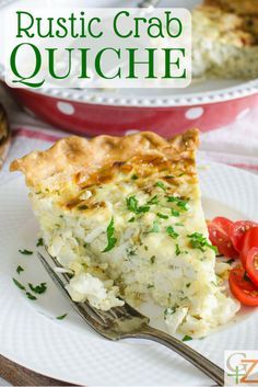 a slice of rustic crab quiche on a white plate with a fork and tomatoes