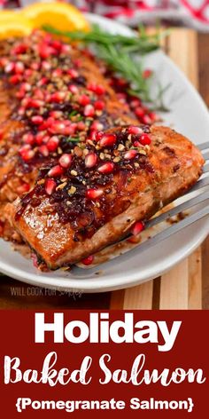 a white plate topped with salmon covered in pomegranate