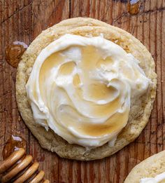 a cookie with icing and honey on top