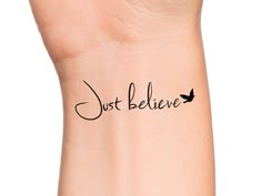 a wrist tattoo with the words just believe on it