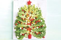 a christmas tree made out of lettuce and tomatoes