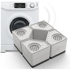 three white containers sitting in front of a washing machine