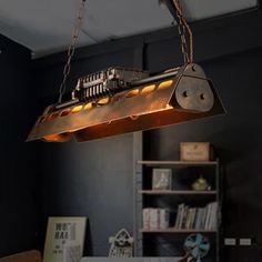 an industrial light fixture hanging from the ceiling