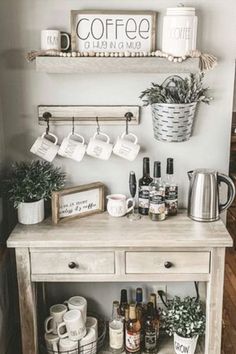 a coffee bar with cups and mugs on it