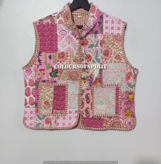 a vest made out of patchwork fabric with the words colours of spirit printed on it