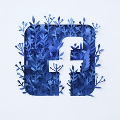 the letter f is made up of blue flowers and leaves in front of a white background