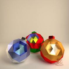 three origami ornaments sitting next to each other